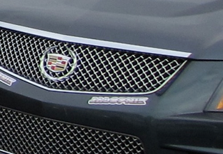 Illustration for article titled Battle Of The Bullrun Booty: Kim Kardashian Or The CTS-V Coupe?